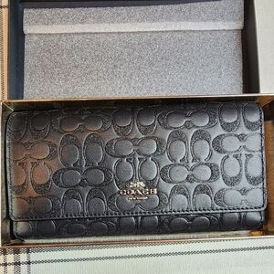 Coach black tri-fold wallet glittery in gift box.